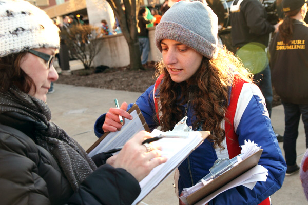 Rachel English, with Grass Roots Organizing, gathers signatures in Columbia.